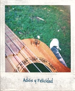 Imagen de un Ukelele y un insecto con la leyenda "Adiós y Felicidad"